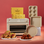 Kitchen appliance with food items and baking tools on a red background