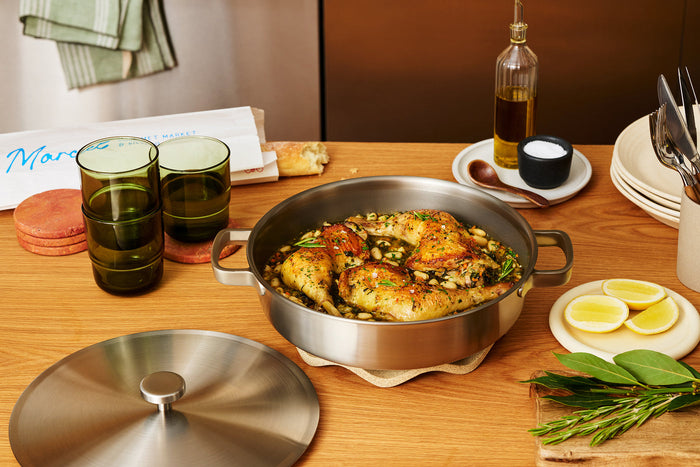 Crispy braised chicken thighs with white beans, spinach, and rosemary