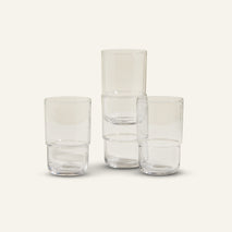 clear tall drinking glasses stacked