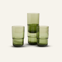 green tall drinking glasses stacked