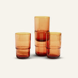 orange tall drinking glasses stacked