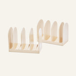 Two light-colored Universal Storage modular racks for cookware with rounded dividers.
