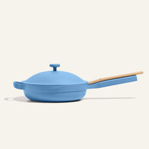 Blue frying pan with a wooden handle on a white background