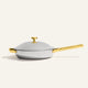 Titanium Always Pan Pro 12.5″ 2.0 silver stainless steel pan with a lid and gold-tone handles and knob.