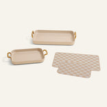 Set of three trays with beige and gold accents on a white background