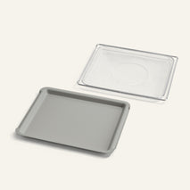 Baking tray with a mesh rack on a white background
